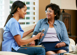 caregiver talking with senior woman